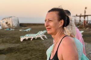 woman in a black swimsuit autumn on the Mediterranean sea 3 photo