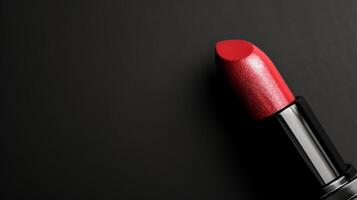 AI Generated Beautiful single red lipstick with a shiny finish isolated on elegant black background photo