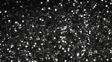 AI generated Black glitter sparkles on a black background. Isolated on a black background. photo