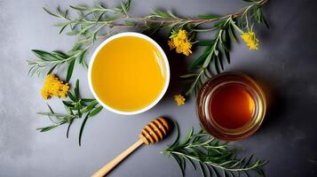 AI generated Bowl of honey, jar of honey, dipper, and wildflowers on grey stone background photo