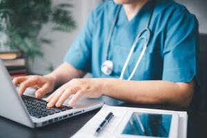 Doctor working in hospital writing a prescription, Healthcare and medical concept, test results in background. Female science student learning how to analyze data on a computer in a laboratory. photo