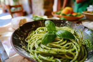 ai generado recién hecho pesto pasta en un mesa en un cinque terre restaurante ideal para italiano cocina y estilo de vida foto