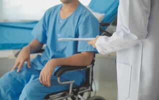 Female doctors who treat patients make an appointment to listen to the results after a physical examination and explain medical information and diagnose the disease. Medical concepts and good healt. photo