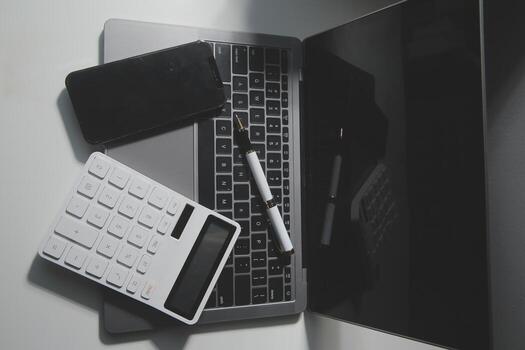 Office leather desk table with calculator and pen. Top view with copy space photo