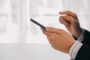 Young woman using apps on a mobile touchscreen smartphone. Concept for using technology, shopping online, mobile apps, texting, addiction, swipe up, swipe down. photo