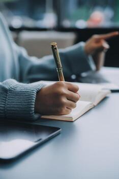 Confident female interpreter translate document from foreign language to english use pc app make notes in paper copy. Professional young woman editor correct errors mistakes in printed article text photo