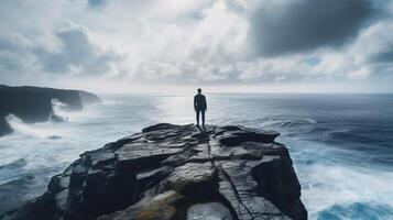 AI generated A person perched on a precipice viewing roaring surf pounded against stones beneath, signifying their reflective temperament. photo