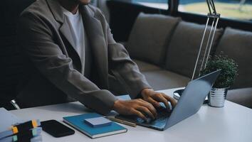 Business team working with new startup project plan and discussion information for financial strategy with laptop and digital tablet in a modern business lounge. photo