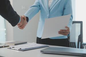 Close up view of job interview in office, focus on resume writing tips, employer reviewing good cv of prepared skilled applicant, recruiter considering application, hr manager making hiring decision photo