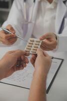 Healthcare service and pharmacy worker with customer at store counter for medication explanation. Pharmaceutical advice and opinion of pharmacist helping girl with medicine information. photo