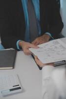 Close up view of job interview in office, focus on resume writing tips, employer reviewing good cv of prepared skilled applicant, recruiter considering application, hr manager making hiring decision photo