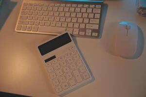 Laptop and paperwork on conference table photo