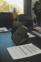 Laptop on a desk in an open financial office. photo