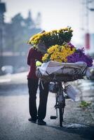 street flower seller in hanoi northern of vietnam photo