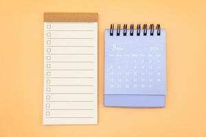 Blank to do list for text with checkbox and Simple desk calendar on MAY 2024. Empty Check list. Copy Space. isolated background. To do list in May 2024. photo