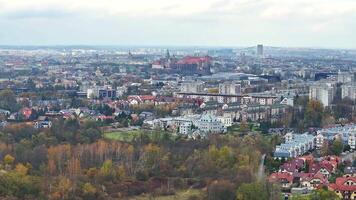 Panoramic View of Krakow Skyline in Autumn, Expansive view over the colorful autumn canopy of Krakow, highlighting the city's diverse architecture and distant hills. video
