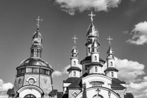 Christian church cross in high steeple tower for prayer photo