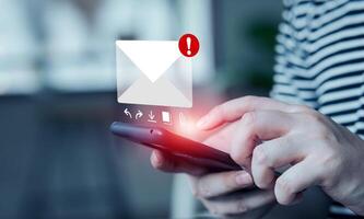 Electronic mail concept. man presses on his smartphone to check electronic mail. Internet messages and online communication, technology, networks photo