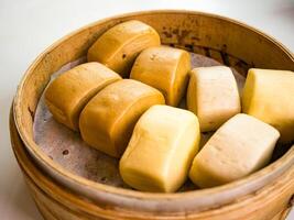 Steamed buns in bamboo steamer photo