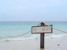 The beautiful soft white bubble of sea waves on the beach in Phuket, Thailand. Space for text photo