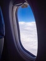 Bright blue sky and white clouds. Beautiful above sky panoramic view from the window of an airplane flying in the clouds. Feeling freedom and new inspiration. Skyline background with copy space photo