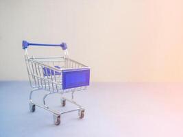 Shopping cart with sunlight effect with copy space for text. Concept of e-commerce photo