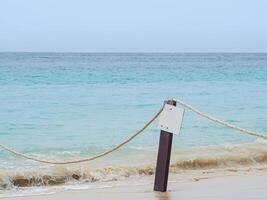 The beautiful soft white bubble of sea waves on the beach in Phuket, Thailand. Space for text photo