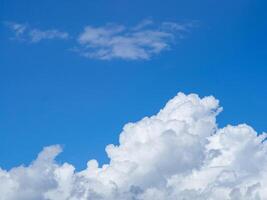 Blue sky with white clouds background. Space for text photo