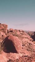 A rock formation in the middle of a desert video