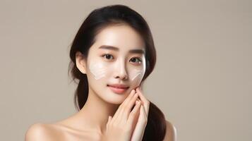 AI generated Asian woman using skincare product. Taking face cream to apply on facial skin photo