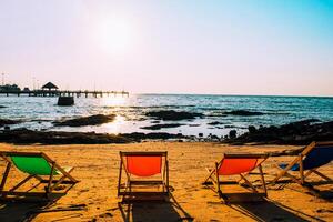 Beach and chairs on the sand by the sea in Bang Saen during summer vacation Sea tourism concept in Thailand. photo