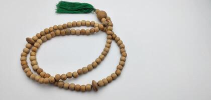 prayer beads from a wooden beads on a white background photo
