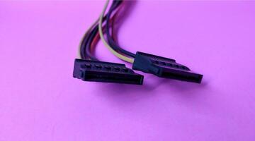 Close up of computer cable isolated on pink background with copy space. photo