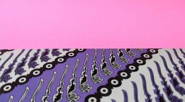 Colorful paper napkins on pink background, closeup of photo