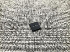 a closeup shot of a white and black and gray textile with a blurred background photo