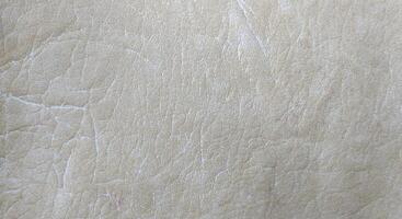 Close up of natural light brown leather texture for background and design. photo