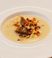 Pumpkin and vegetable cream with croutons photo