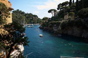 streets, bays and yachts on the charming coast of Portofino in northern Italy on a summer day photo