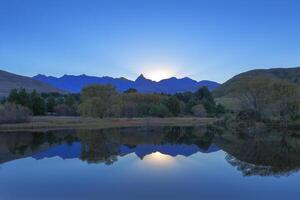 Reflection of Rhino Peak on the water photo