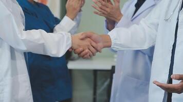 A handshake between an MR and a doctor who comes to the hospital on a sales call and shakes hands to seal the deal. Faceless scene. video