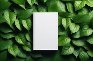 AI Generated Blank book cover mockup on green leaves background. photo