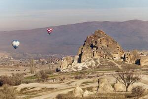 View of the natural beauty of the Rose Red Valley in Cappadocia, Turkey. Famous destination for hikers to explore the Rock Sites of Cappadocia. photo