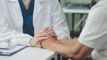 Emotional comfort stored in fingerprints. Shot of an unrecognizable doctor holding hands with her patient during a consultation. video