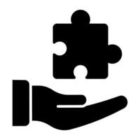 Jigsaw on hand symbolising concept of solution provider icon vector