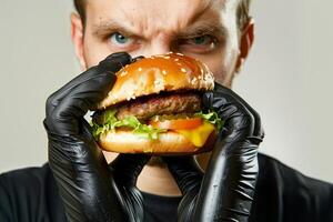 AI generated A man in black gloves holds a burger in his hands photo