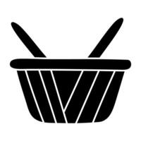 A glyph design icon of shopping basket vector