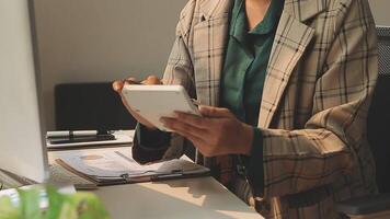 Business woman using calculator for do math finance on wooden desk in office and business working background, tax, accounting, statistics and analytic research concept video