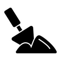 A solid design icon of digging, mud with shovel vector