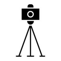 Cam on stand, tripod camera icon vector