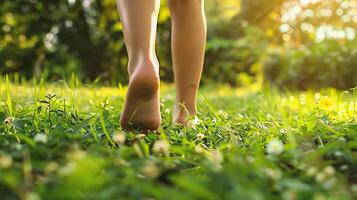 AI generated Close up of woman legs walking on green grass in the park. photo